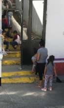 Children play on the steps at the shelter