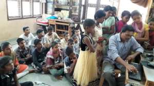 Orphan Children learning excellent computer skills