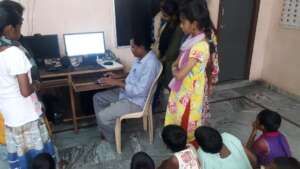 Orphan children learning computer skills in india