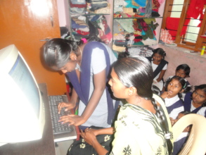 Orphanchildren learning computer skills training
