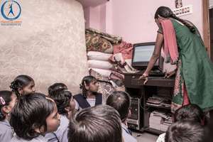 Orphan street children learning computer skills