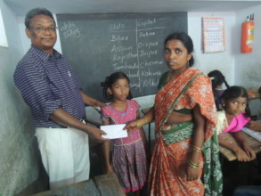 Child and her mother receiving scholarship