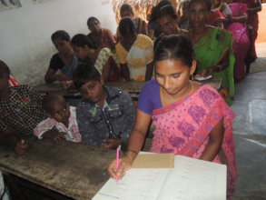 Child mother is signing the register in the school
