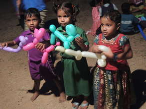 Children with their handmade balloon toys