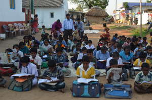 Children are reading -teachers  clarifying doubts