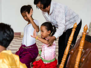 Neark Kru Savorn teaching dance exercises