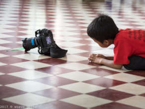 Tong looking through the lens..