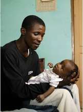 Mohammed Fofana fathering mother-less infant son