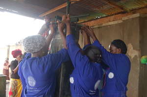 The women extract their first filter from the mold