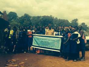 Women with the Deputy Warden outside of the prison