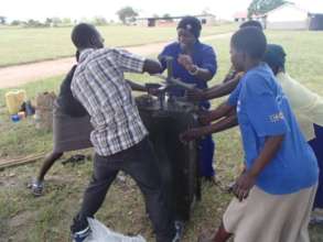 Women and men working together to extract filters