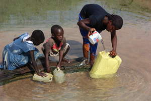 Children fetch dirty water before school