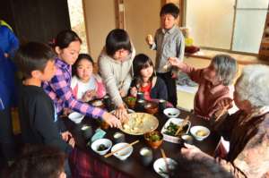 Locals having lunch with children