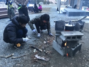 Rocket Project children starting fire to cook rice