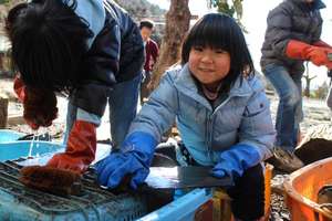 Kids washing slate material for roof
