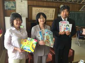 Book donation to Kazuma ES Principal