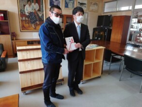 Endo-san presenting book coupon to Vice-Principal