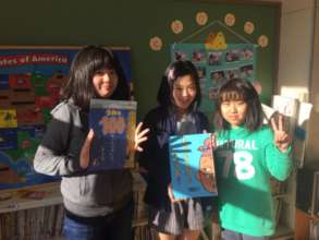 Mangokuura ES 5th Graders read books to 2nd Grade