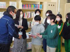 Okaido ES Students Receiving Books