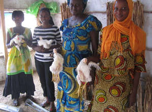 Co-op members sell chickens at local markets