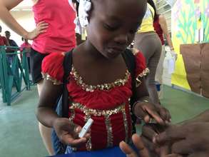 2015 Camp de L'amitie Camper Checking Her Blood