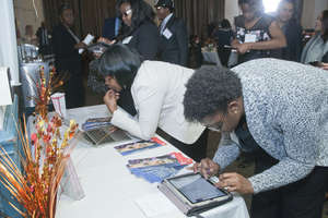 Scholars reviewing the online book