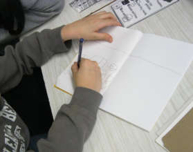 PS69 3rd grader sketching Family Storybook