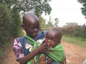 Girl mothering baby