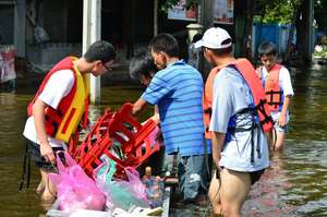 Boys emulate their leader in serving the community