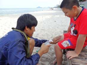 Teen Leader Caring for a Young Camper