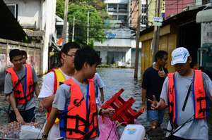 Wading through water to distribute lifepacks