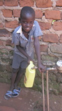 Denis fetching water