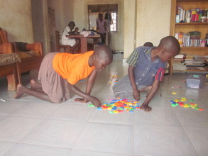 Sandra and Mark practicing their letters