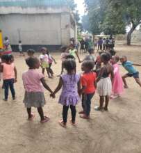 Younger children playing Zambian games