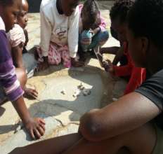 Children engaged in a traditional Zambian game