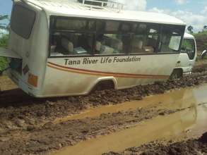 Bus stuck in the mud during the rainy season