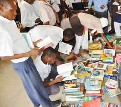 Students browsing books from the mobile library