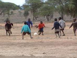 Kids Playing Football with an Alive & Kicking Bal