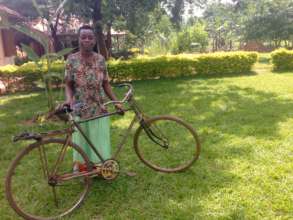 Teopista alongside her new bicycle.