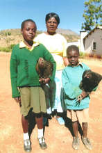 Anesu and Morelife with their chickens