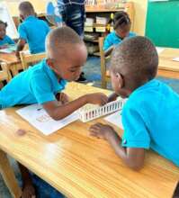 Preschool students learning letters