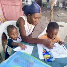 Yspaniola student working with his mum and brother