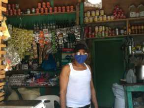 Colmado owner, Fernando, in his community store
