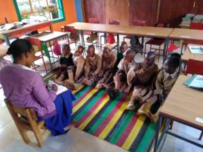 Teacher Working with Class on Reading