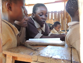 Children Reading at Acres of Mercy