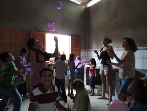 Playing with the moms' kids during the event!