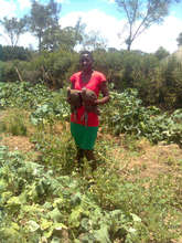 Violet and her garden with seeds from AFCA