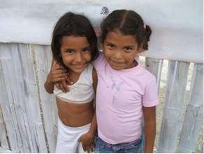 Julia and Maria playing by the Fence