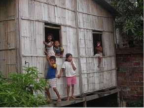 Children Playing in a Bamboo House