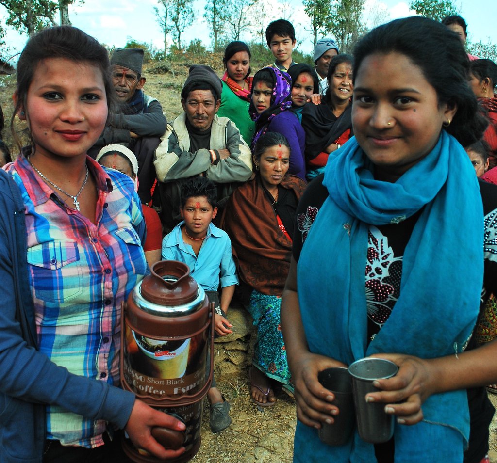 Alisha, right, serving milk tea.